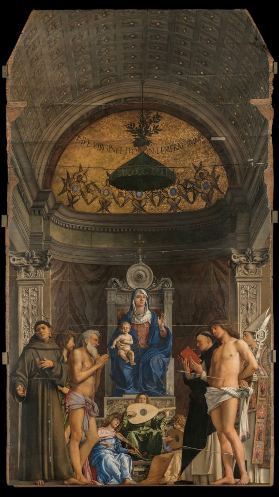 a large painting of madonna and child with saints around them