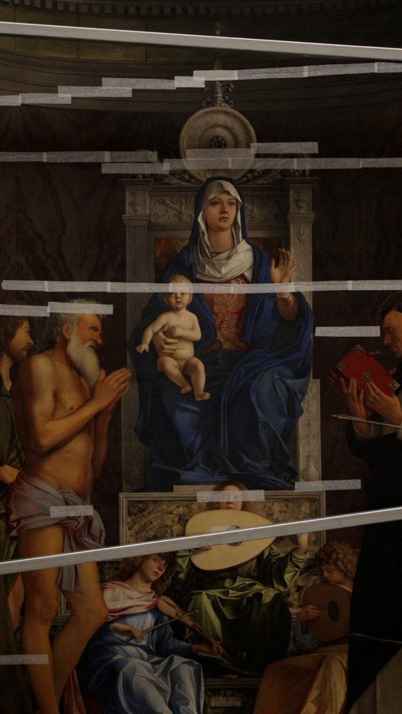 a painting of Madonna and child with tape over it