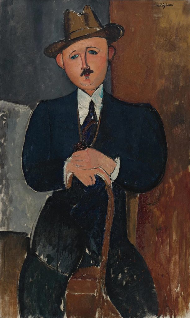 A painting by Amedeo Modigliani with one of his typical elongated figures, a man in a black suit and tie and brown fedora, sitting with a brown cane, against a brown and blue-gray backdrop.