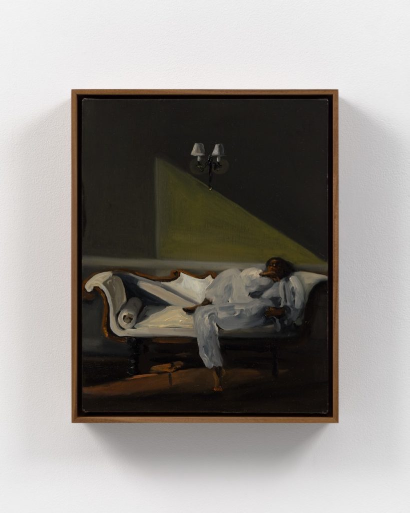 A painting of a Black woman lying on a white chaise lounge in a dimly lit room, wearing a loose white dress, with a triangular beam of yellow light on the wall behind her and a small wall sconce above.