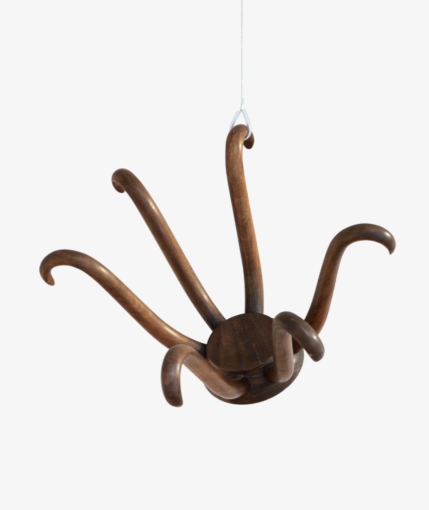 an image of a wood sculpture hat rack displayed upside down