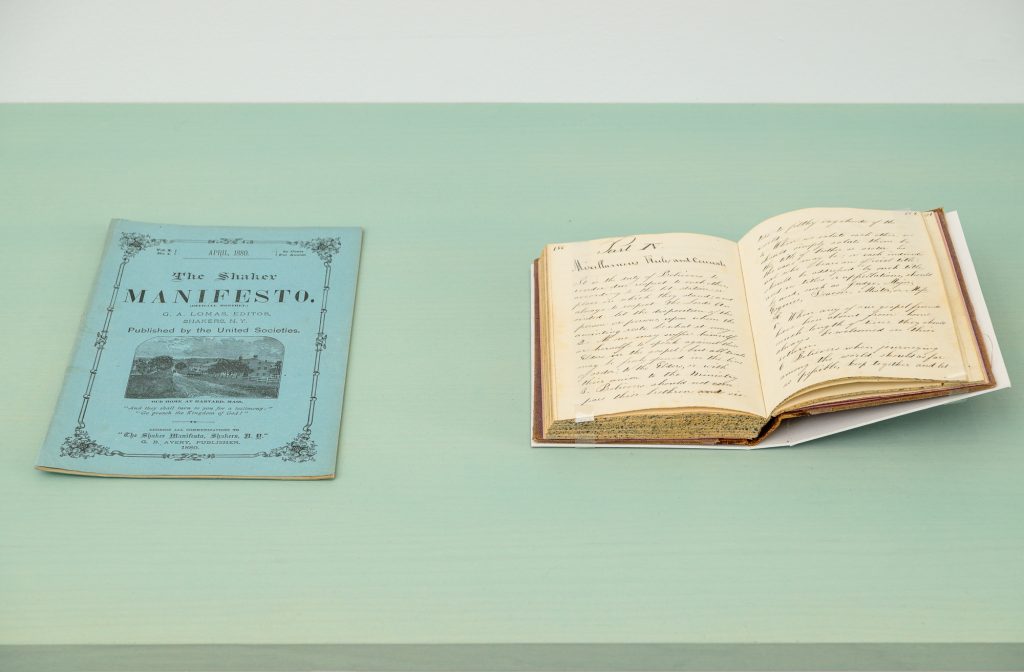 an image of a blue pamphlet with the Shaker Manifesto printed on the cover