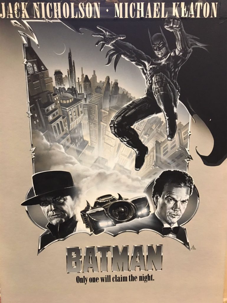 Black-and-white Batman poster composite by John Alvin featuring Gotham skyline, Batmobile, and opposing villain portraits in dramatic montage.