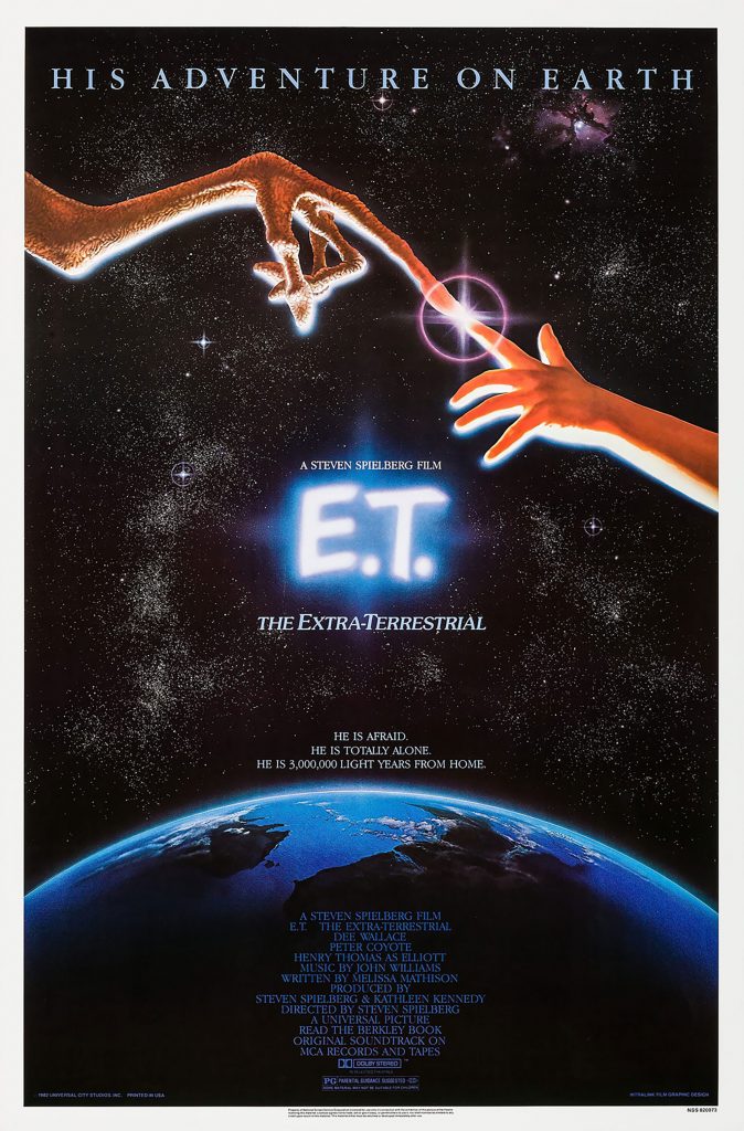 Iconic E.T. poster by John Alvin shows alien and child fingers touching, glowing light above Earth in space.