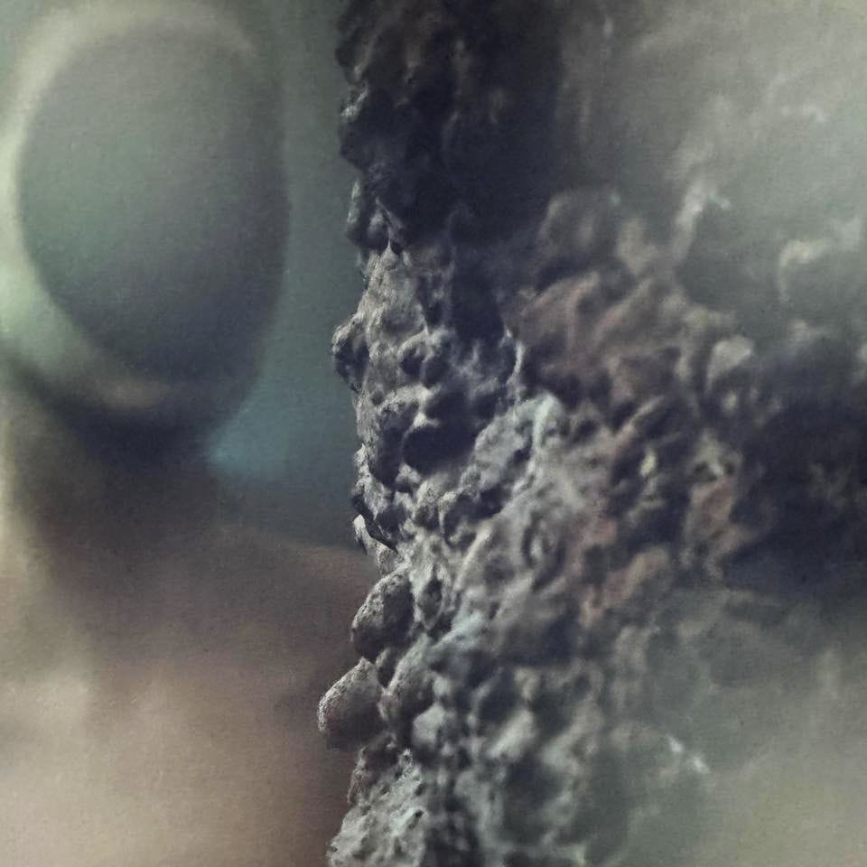 Figure with a hole in her head