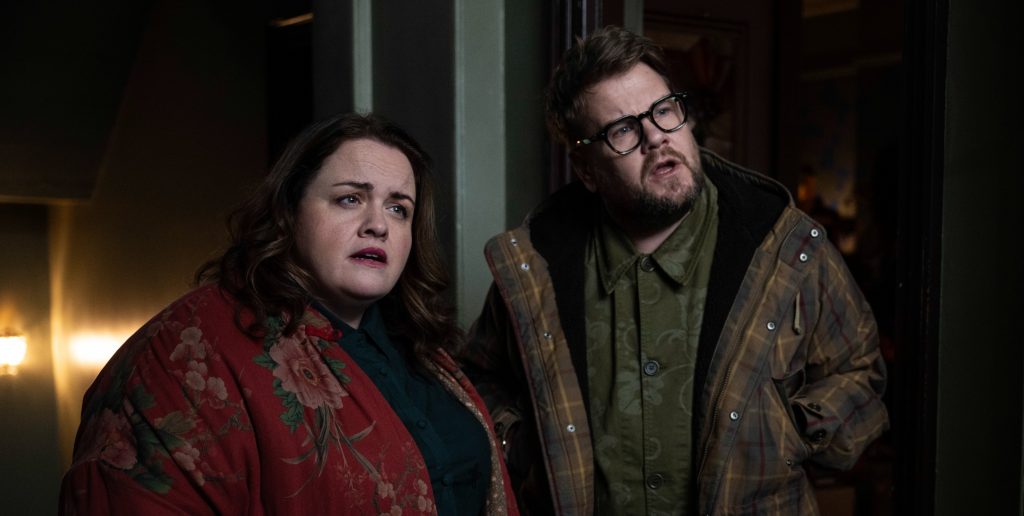 A man and a woman looking off-camera with quizzical faces