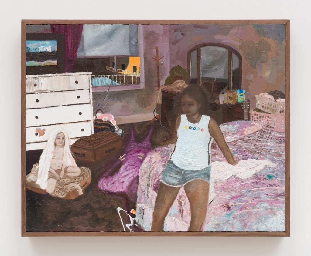 Framed painting by Veronica Fernandez of a bedroom interior showing a young girl sitting on a bed with a pink patterned bedspread. The room contains a white dresser, a suitcase, a doll seated on the floor, and laundry baskets, with a window revealing a balcony outside. The scene is rendered in thick, expressive brushstrokes with soft pink, purple, and brown tones.