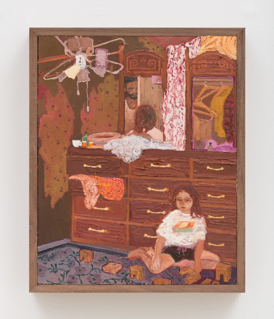 Framed painting by Veronica Fernandez of a bedroom scene with a young child sitting on the floor in front of a large wooden dresser. The dresser’s mirror reflects an adult figure standing in a doorway behind them. Clothing hangs from open drawers and a nearby wardrobe, while toys are scattered on a patterned rug. The room is rendered with warm brown, pink, and orange tones in thick, textured brushstrokes.